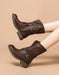 Brown leather boots with buckles on a beige background