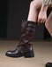 Brown leather boot with buckles on a neutral background