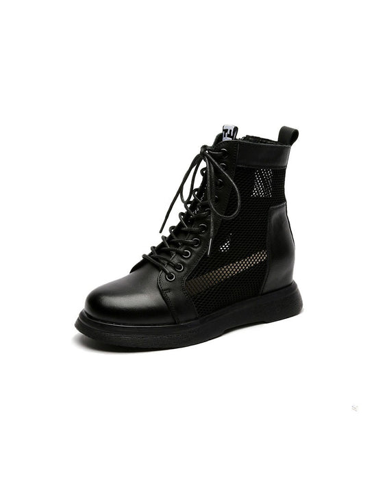 Black lace-up boot with a white background