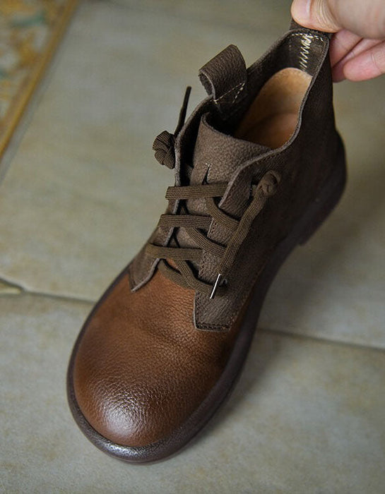 Brown leather shoe on a tiled floor